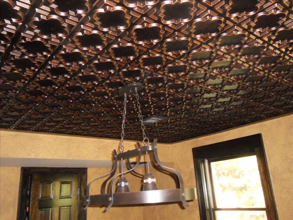 Antique ceiling copper looking ceiling tiles installed in a mancave.